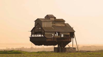 An abandoned potato sorting station near Krasnosilka, Ukraine with a unusual, cantilevered design. The concrete block at the end forms the counterweight of the structure, creating the impression it floats over the fields.  Photographer unknown.