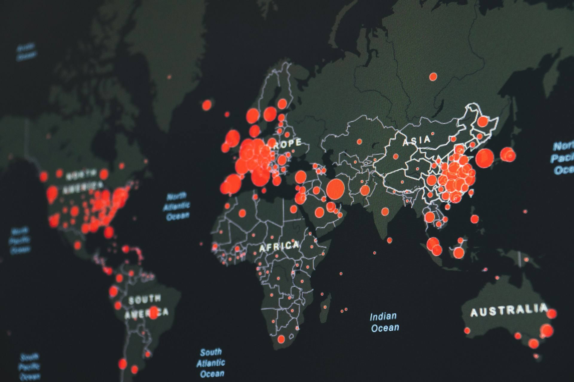 Global outbreak map showing red circles of varying size marking case concentrations across Europe, Asia, North America, Africa, and Australia, with the largest clusters visible over Europe and East Asia.