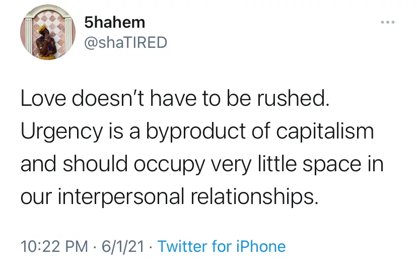 Tweet screenshot stating that love shouldn't be rushed, calling urgency a byproduct of capitalism that should occupy very little space in our interpersonal relationships.