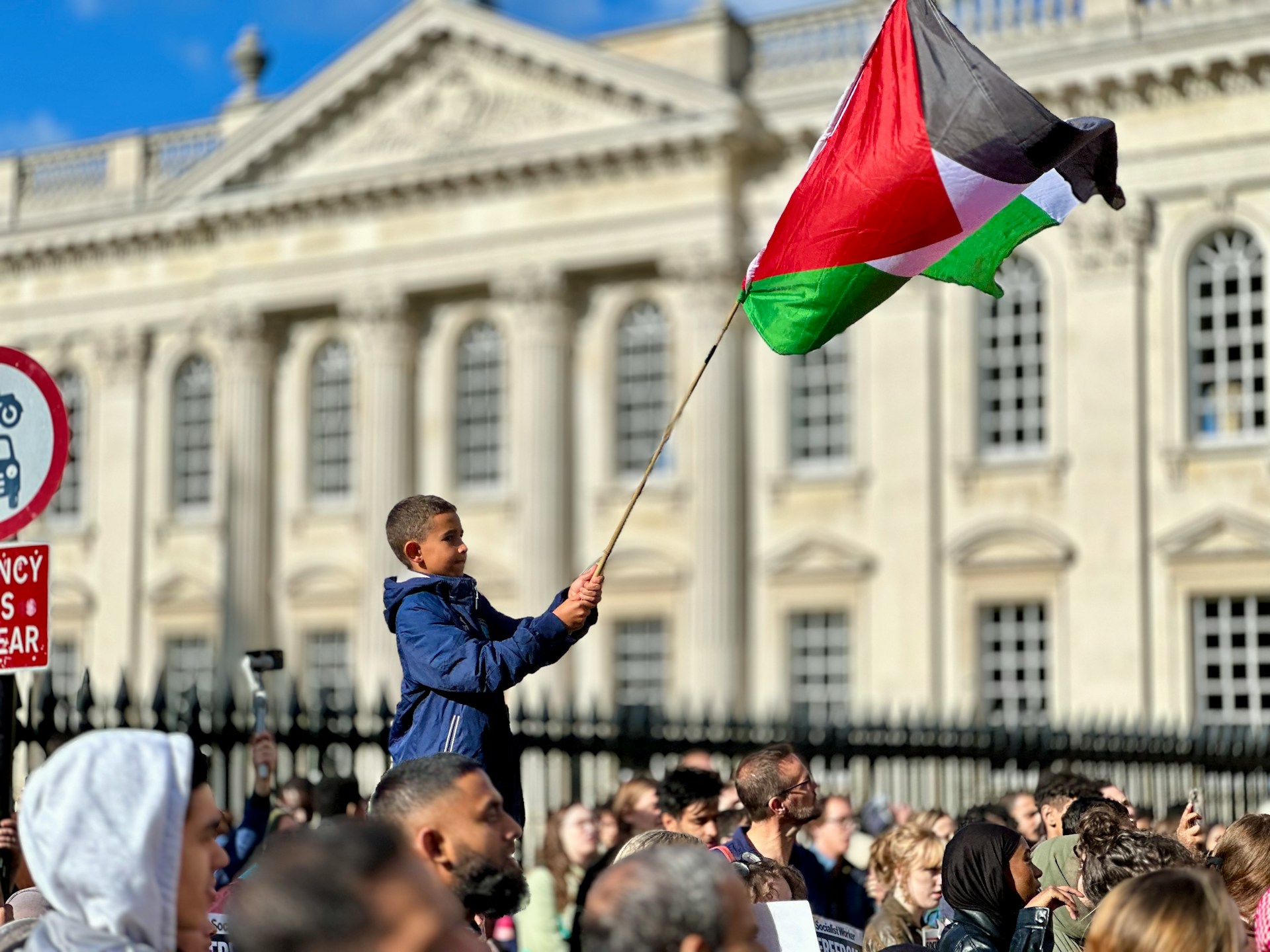 Boy waving Palestine flag