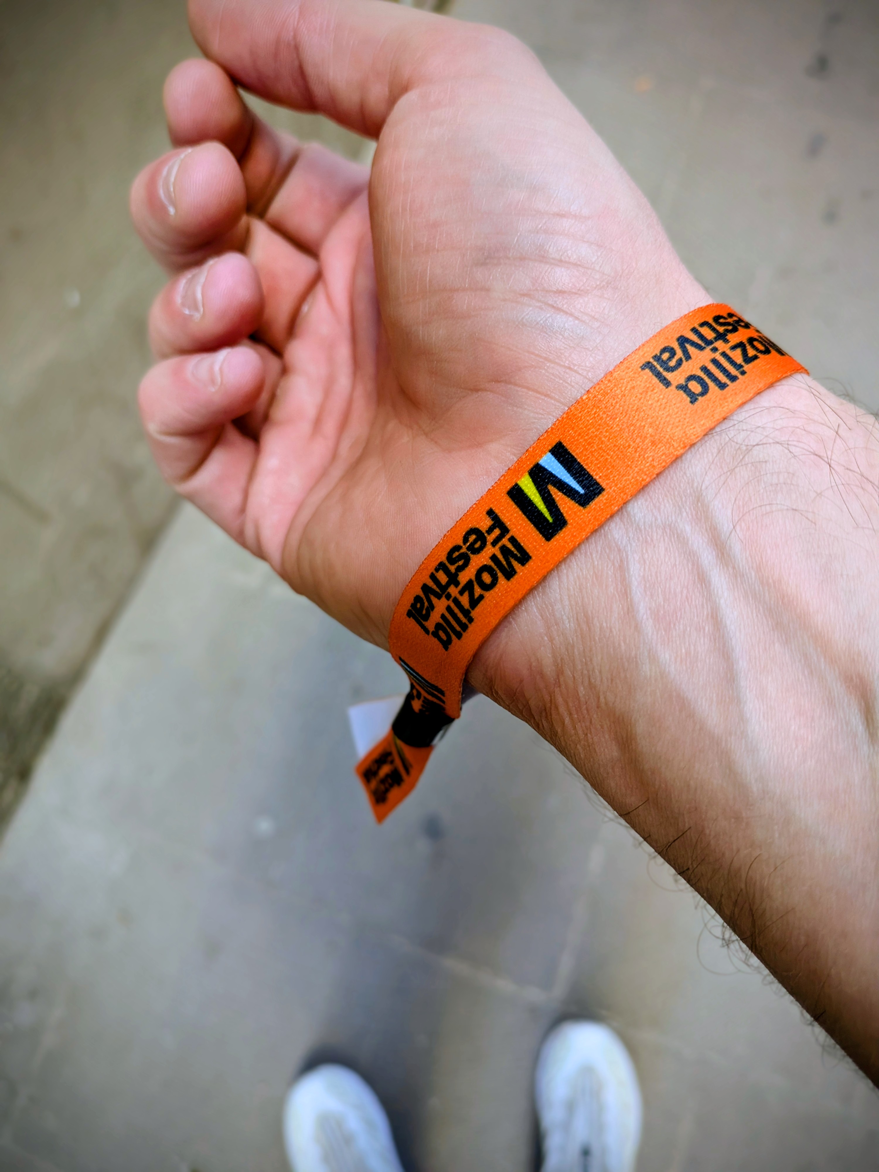 Doug's arm showing a MozFest 2025 wristband