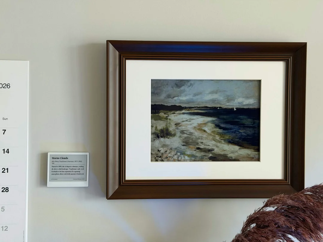 Larger colour e-ink display showing artwork with smaller, monochrome e-ink display providing information about it